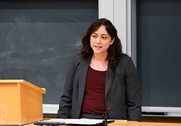 Nicole Morote stands behind a podium.