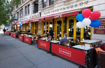 Tables outside the Le Monde Cafe on Broadway