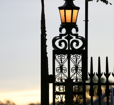 A lamp post with the Columbia crown on at the gates of campus