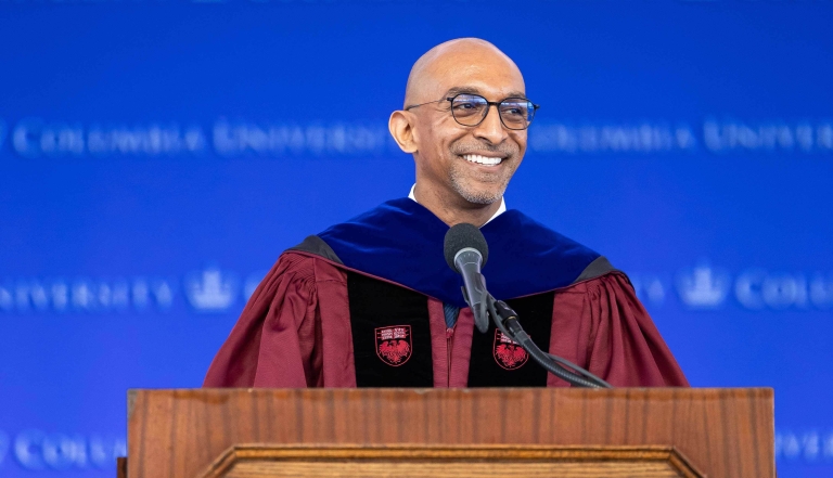 Dean Daniel Abebe at podium