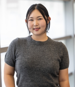 Diane Kim in gray short sleeve shirt