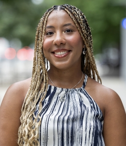 Elizabeth Betts in striped sleeveless top