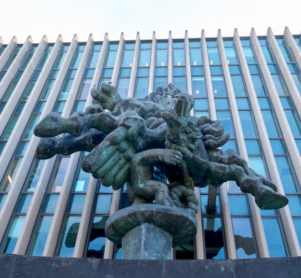 A view from below of the statue of Pegasus in front of Jerome Greene Hall