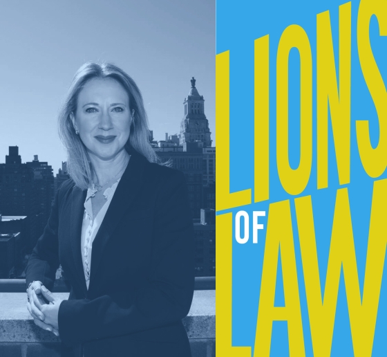 Woman on rooftop next to Lions of Law logo