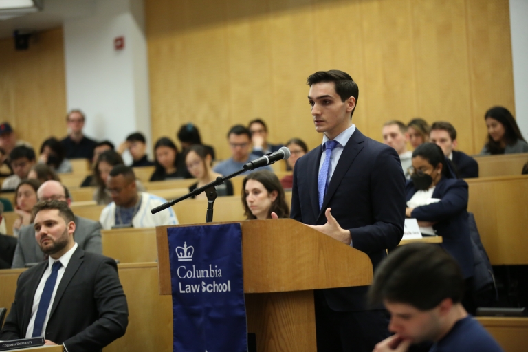 Man stands at a podium